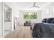 Bright main bedroom with large windows, hardwood floors, and ensuite bathroom at 508 N Wake St, Hillsborough, NC 27278