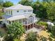 Beautiful white home featuring a spacious deck, screened porch, and fenced backyard at 508 N Wake St, Hillsborough, NC 27278