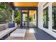 Relaxing screened porch featuring stylish furniture and views of the lush backyard at 508 N Wake St, Hillsborough, NC 27278
