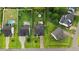 Aerial view showcasing multiple homes with well-maintained lawns, driveways, and surrounding greenery at 52 Summit Overlook Dr, Clayton, NC 27527