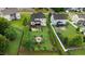 Aerial view of a home featuring a spacious backyard with a fire pit area and pergola-covered seating at 52 Summit Overlook Dr, Clayton, NC 27527