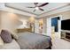 This is a primary bedroom with a tray ceiling, neutral colors, an ensuite, and walk-in closet access at 52 Summit Overlook Dr, Clayton, NC 27527