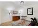 Bonus room featuring a wood floor, musical keyboard, a dresser, and exercise equipment at 52 Summit Overlook Dr, Clayton, NC 27527
