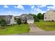 Attractive two-story home with a lush front yard and attached two-car garage at 52 Summit Overlook Dr, Clayton, NC 27527