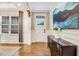Foyer with hardwood floors, wainscoting, decorative console table, and stylish artwork at 52 Summit Overlook Dr, Clayton, NC 27527