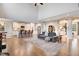 Spacious living room with hardwood floors, high ceilings, and an open floor plan to the kitchen at 52 Summit Overlook Dr, Clayton, NC 27527