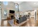 Bright living room featuring hardwood floors, a fireplace, and an open floor plan at 52 Summit Overlook Dr, Clayton, NC 27527