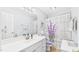 Bathroom with a white sink, vanity, and toilet and floral shower curtain at 5309 Meadow Field Dr, Mebane, NC 27302