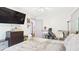 Bedroom featuring a bed, dresser, tv, and a comfy gray chair near the desk at 5309 Meadow Field Dr, Mebane, NC 27302