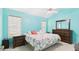 Bedroom with vaulted ceilings and dresser, two night stands and floral comforter at 5309 Meadow Field Dr, Mebane, NC 27302
