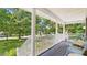 Inviting front porch with seating, plants and a nautical-themed decoration at 5309 Meadow Field Dr, Mebane, NC 27302