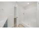 Bright bathroom with walk-in shower and view to the other rooms of the house at 58 W Emily Gardens Dr, Selma, NC 27576