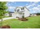 Charming two-story home featuring a two-car garage and well-maintained lawn with fresh landscaping at 58 W Emily Gardens Dr, Selma, NC 27576