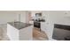 Kitchen with white cabinets, granite countertops, stainless steel appliances, and an island with a sink at 58 W Emily Gardens Dr, Selma, NC 27576