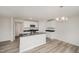 Well-lit kitchen featuring granite countertops, white cabinets, stainless steel appliances, and an island with a sink at 58 W Emily Gardens Dr, Selma, NC 27576