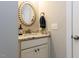 Bathroom vanity with granite counters, decorative round mirror and modern fixtures, perfect for guest at 604 Doddington Dr, Rolesville, NC 27571