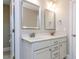 Bright bathroom featuring double sink vanity, and modern fixtures at 604 Doddington Dr, Rolesville, NC 27571
