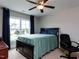 Comfortable bedroom with large window, ceiling fan and neutral carpet at 604 Doddington Dr, Rolesville, NC 27571