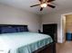 Bedroom with a bed, ceiling fan, and an open closet for extra storage at 604 Doddington Dr, Rolesville, NC 27571