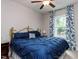Inviting bedroom featuring a comfortable bed, soft lighting, and a window with scenic views at 604 Doddington Dr, Rolesville, NC 27571