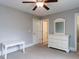 Neutral bedroom featuring gray walls, ceiling fan, white trim and furniture at 604 Doddington Dr, Rolesville, NC 27571