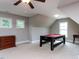 Large bonus room with a pool table, carpeted floors and vaulted ceilings at 604 Doddington Dr, Rolesville, NC 27571