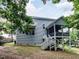 Exterior of a two-story home with vinyl siding and a screened porch at 604 Doddington Dr, Rolesville, NC 27571