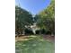 Charming gazebo nestled among lush trees and manicured landscaping in a serene community setting at 604 Doddington Dr, Rolesville, NC 27571