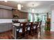 Modern kitchen island with barstool seating, pendant lights, and open layout at 604 Doddington Dr, Rolesville, NC 27571