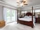 Bright main bedroom with balcony access through french doors, ceiling fan and great natural light at 604 Doddington Dr, Rolesville, NC 27571