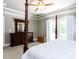 Comfortable main bedroom suite featuring a four-poster bed, dresser and french doors to a balcony at 604 Doddington Dr, Rolesville, NC 27571
