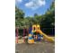 Colorful community playground featuring slides, climbing structures, and swings, perfect for outdoor fun at 604 Doddington Dr, Rolesville, NC 27571