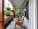 Inviting porch with rocking chairs and decorative hanging flower baskets at 604 Doddington Dr, Rolesville, NC 27571