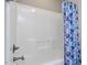 Clean shower area with a modern shower head and unique shower curtain at 604 Doddington Dr, Rolesville, NC 27571