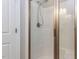 Tiled shower with glass door providing a clean, functional space in the bathroom at 604 Doddington Dr, Rolesville, NC 27571