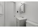 Clean, neutral bathroom featuring a sleek vanity with a framed mirror and modern lighting at 625 Powell Dr, Rocky Mount, NC 27803