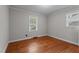 This simple bedroom features hardwood floors and natural light from two windows at 625 Powell Dr, Rocky Mount, NC 27803