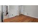 This bedroom entrance features hardwood floors, white trim, and an open doorway to the bathroom at 625 Powell Dr, Rocky Mount, NC 27803
