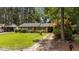 Well-maintained single story brick home with an adjacent covered carport and a mature, landscaped front yard at 625 Powell Dr, Rocky Mount, NC 27803