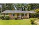 Charming single-story brick home featuring a well-maintained lawn and a welcoming front entrance at 625 Powell Dr, Rocky Mount, NC 27803