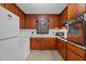 Functional kitchen featuring wood cabinets, light countertops and modern appliances at 625 Powell Dr, Rocky Mount, NC 27803