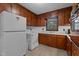 Functional kitchen featuring wood cabinets, light countertops and modern appliances at 625 Powell Dr, Rocky Mount, NC 27803