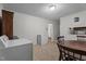 A glimpse of a laundry room showing both a washing machine and a dining table at 625 Powell Dr, Rocky Mount, NC 27803