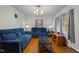 This bright living room features hardwood floors and matching blue reclining sofas at 625 Powell Dr, Rocky Mount, NC 27803