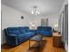 This bright living room has hardwood floors and matching blue reclining sofas and plenty of light at 625 Powell Dr, Rocky Mount, NC 27803