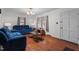 This cozy living room features hardwood floors and comfortable blue reclining sofas at 625 Powell Dr, Rocky Mount, NC 27803