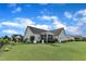 Spacious backyard with lush green grass and a view of the house and fenced garden at 71 Smithsanders Ct, Smithfield, NC 27577