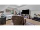 Attic bedroom with dormer windows and white shiplap walls, and a television console at 71 Smithsanders Ct, Smithfield, NC 27577