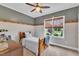 Comfortable bedroom with a ceiling fan, and a large window overlooking the front yard at 71 Smithsanders Ct, Smithfield, NC 27577