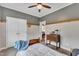 Cozy bedroom with a ceiling fan, and a door that offers a glimpse into another room at 71 Smithsanders Ct, Smithfield, NC 27577
